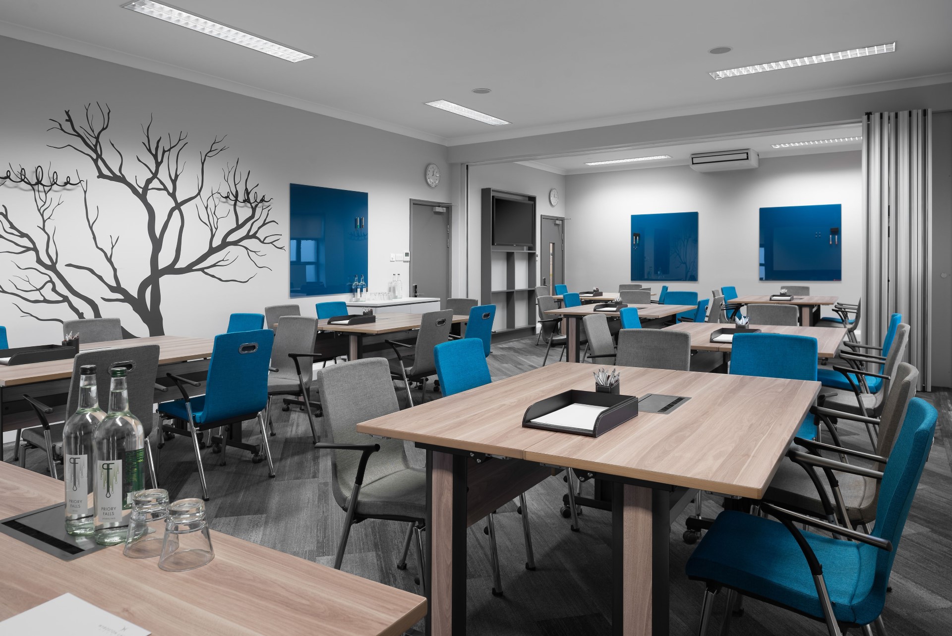 modern training room with blue and grey chairs
